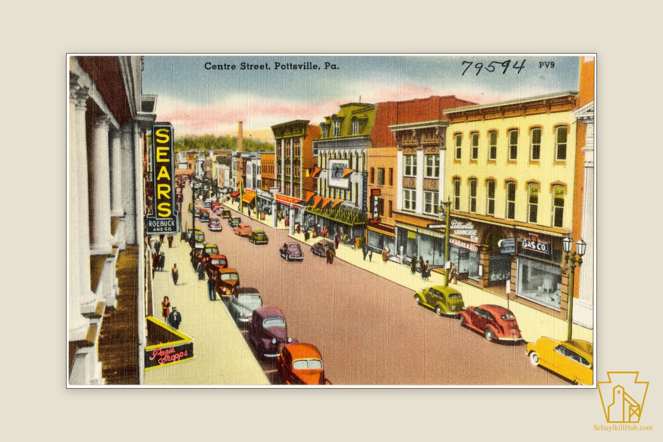 Color linen postcard looking down Centre Street, Pottsville — storefronts, blade signs and parked automobiles.