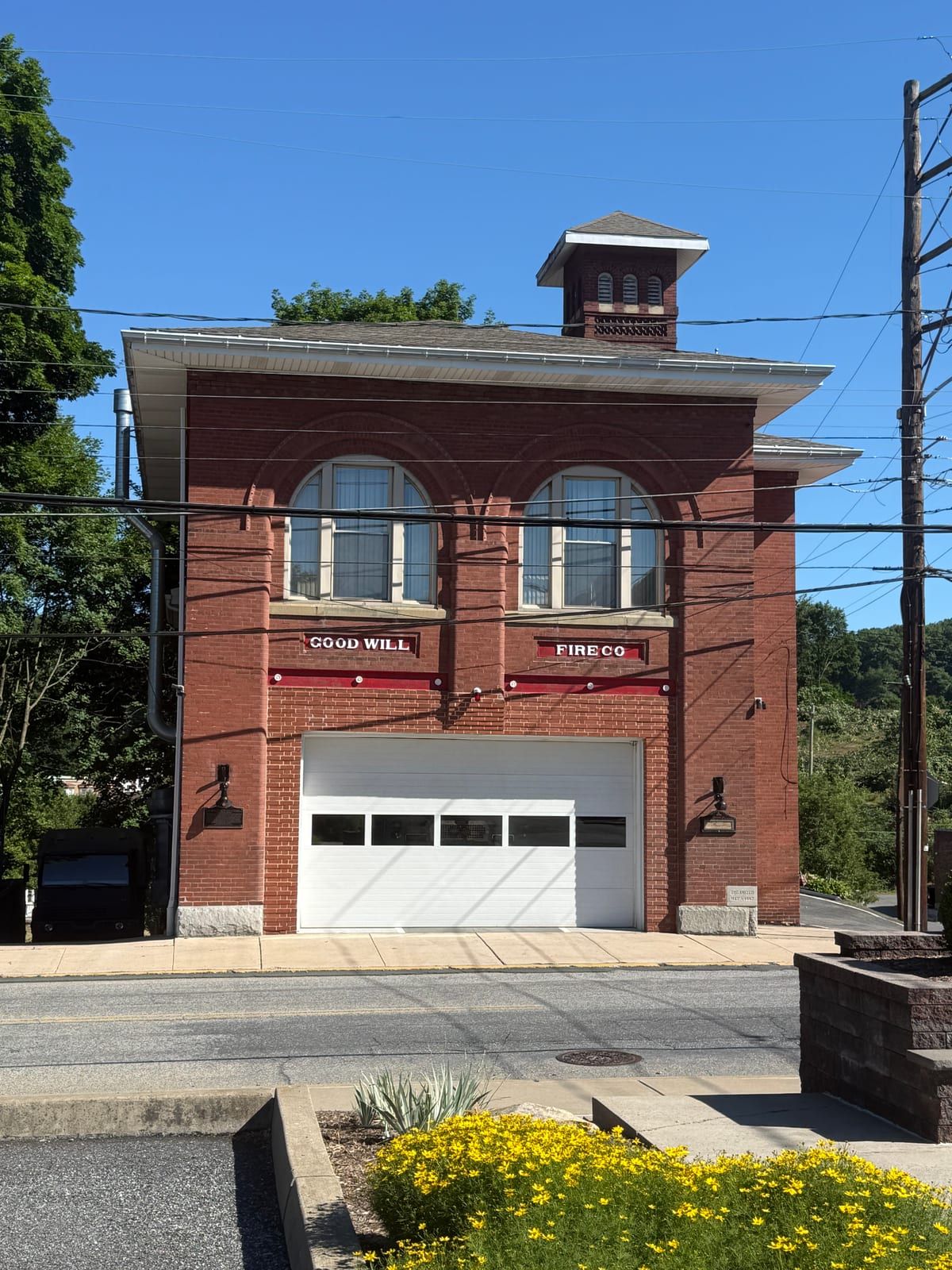 The Good Will Fire Company No. 4 firehouse in Pottsville — a brick station with twin arched bays and a rooftop cupola.