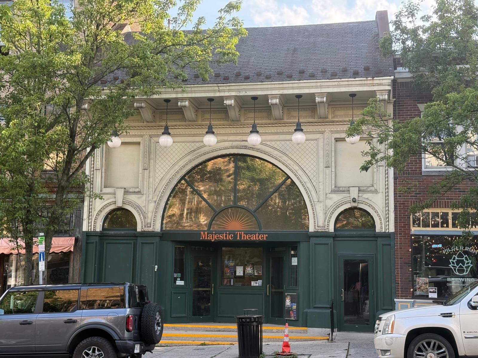The Majestic Theater on North Centre Street in Pottsville — an ornate facade with a large arched window and a lit marquee.