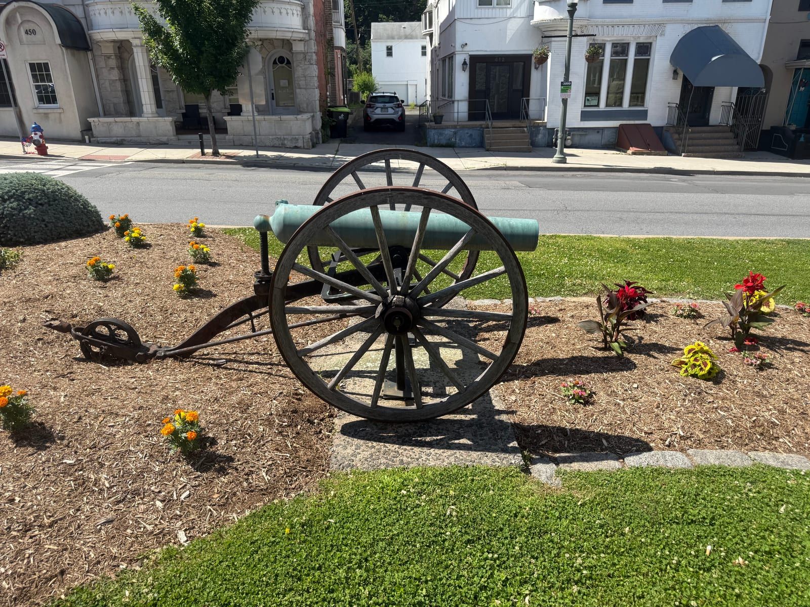A field cannon on display in a planted median at Garfield Square, Pottsville.