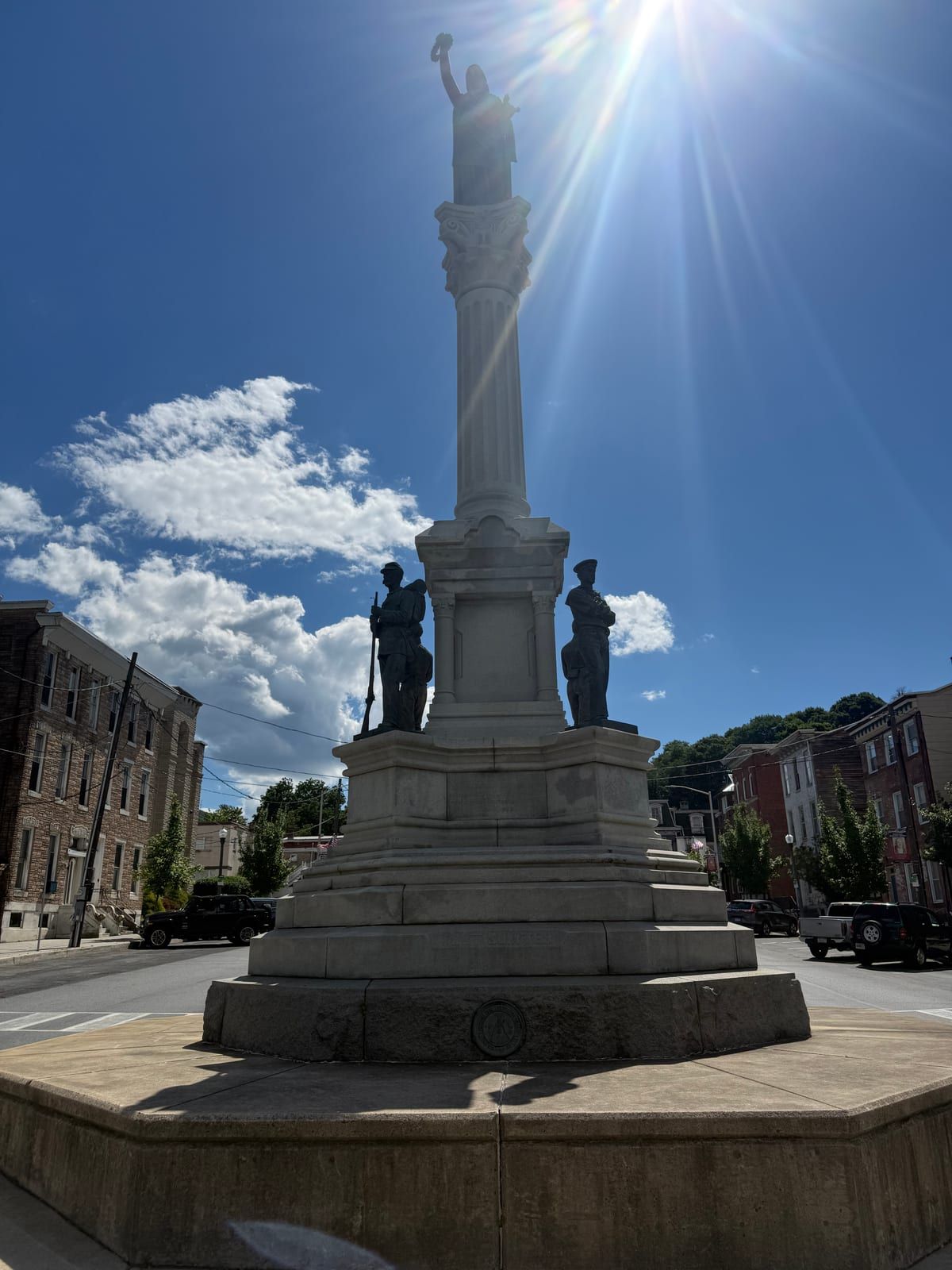 The granite column of the Soldiers' & Sailors' Monument rising against the sky in Garfield Square, Pottsville.