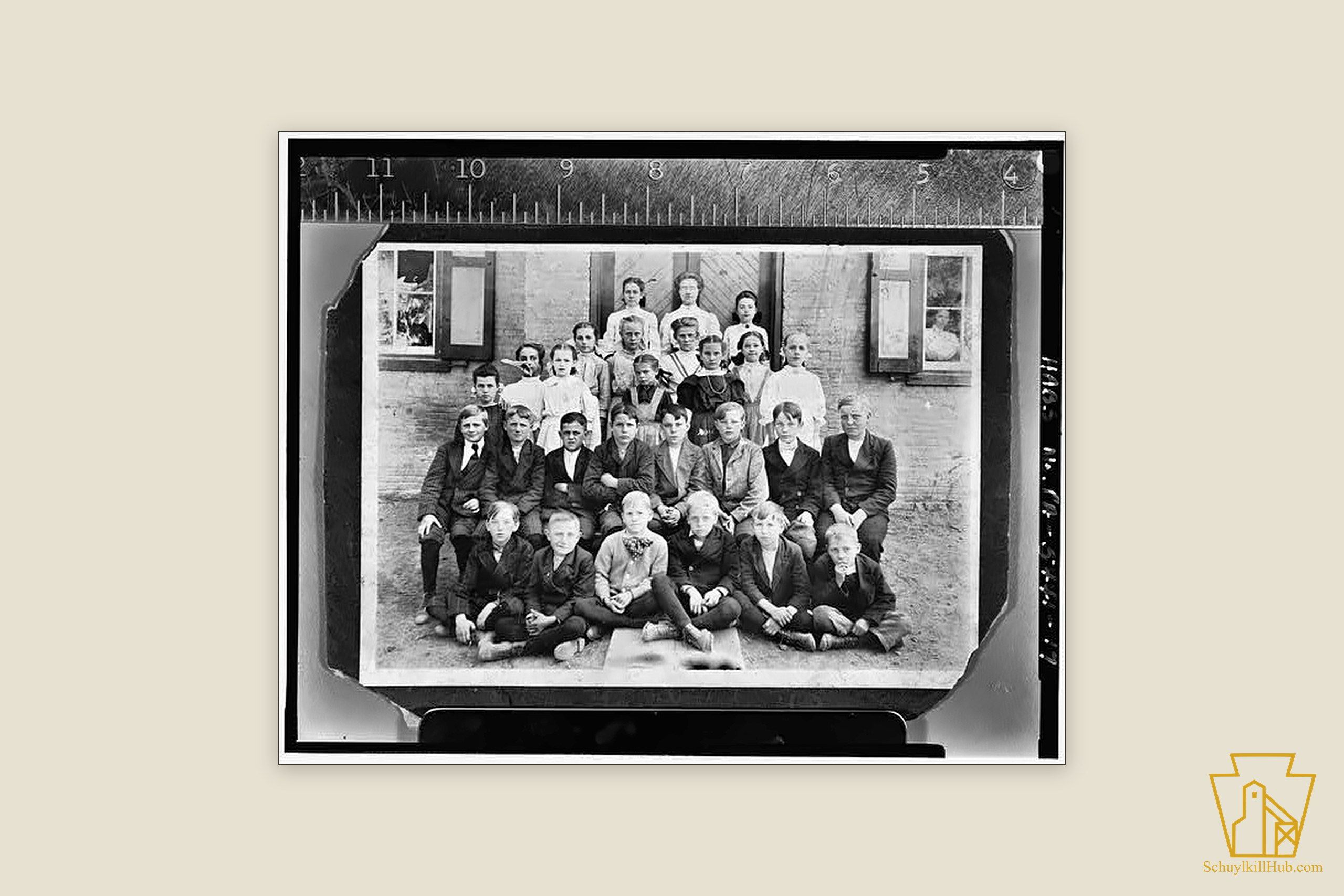 Pupils and their teacher posed outside the clapboard Lavelle School, about 1890.