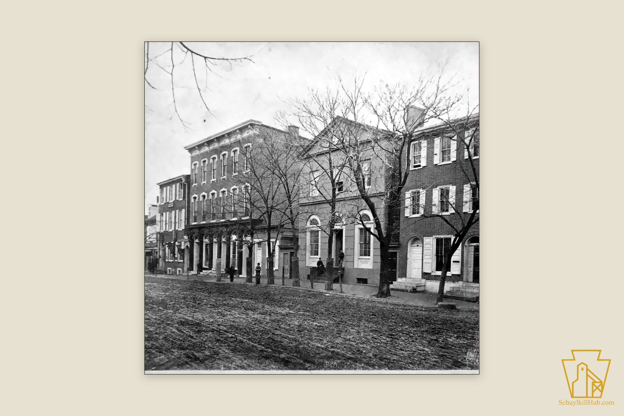 Row of three-story brick dwellings along a Pottsville street — a stereograph frame.