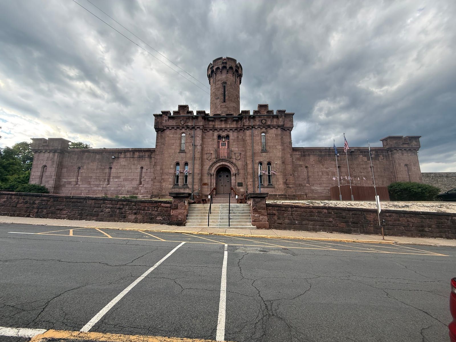 The Schuylkill County Prison in Pottsville — a castellated brownstone jail with a battlemented central tower and an arched entrance.